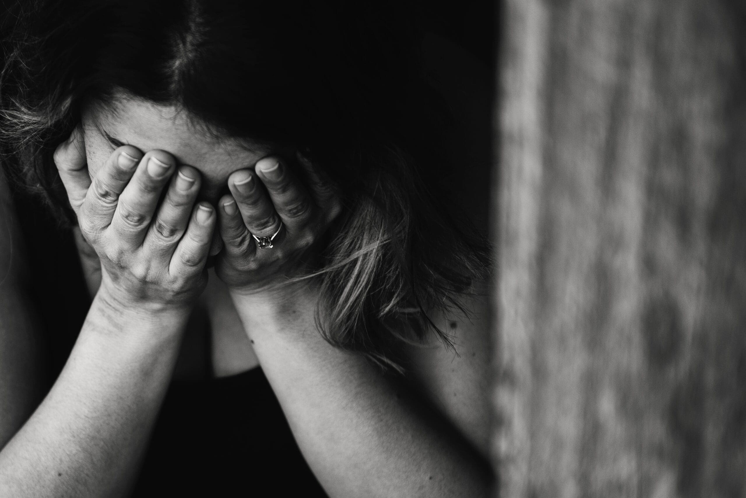 Woman with her head in her hands